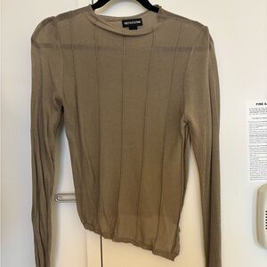 Asymmetrical long sleeve sheer top